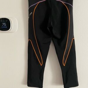 CW-X Black Leggings with Vibrant Orange and Purple Details size small